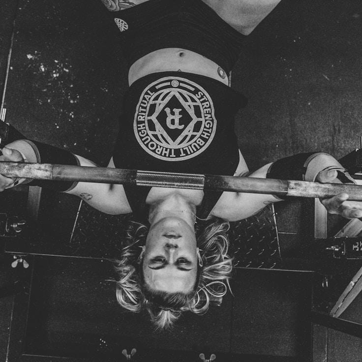 Interior of a professional gym with weight training equipment and mirrors